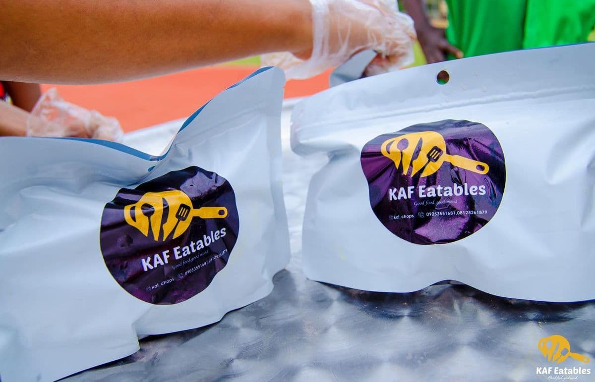 Two KAF Eatables branded packaging pouches being sealed