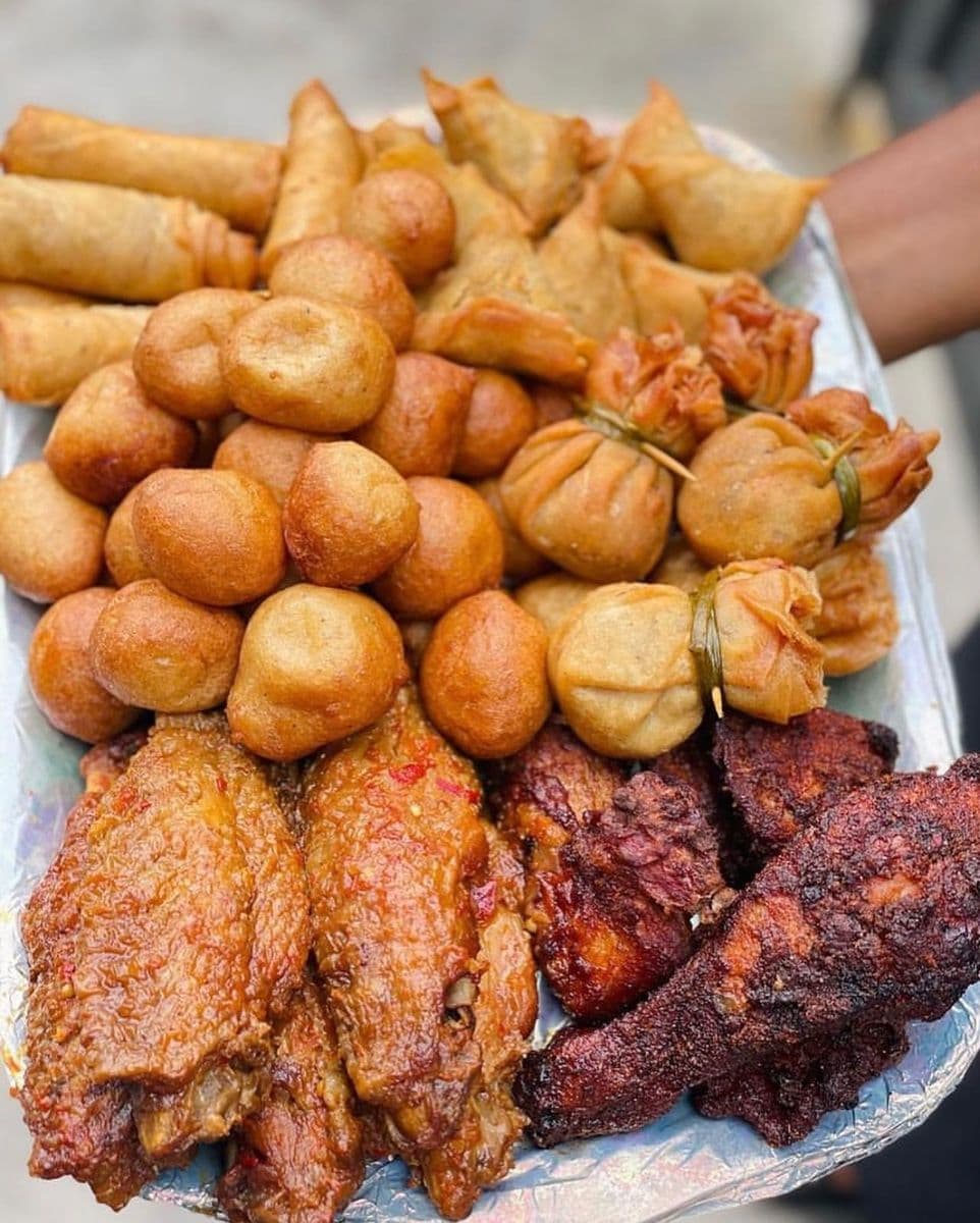 KAF Eatables small chops platter with spring rolls, puff puff, samosa and peppered chicken