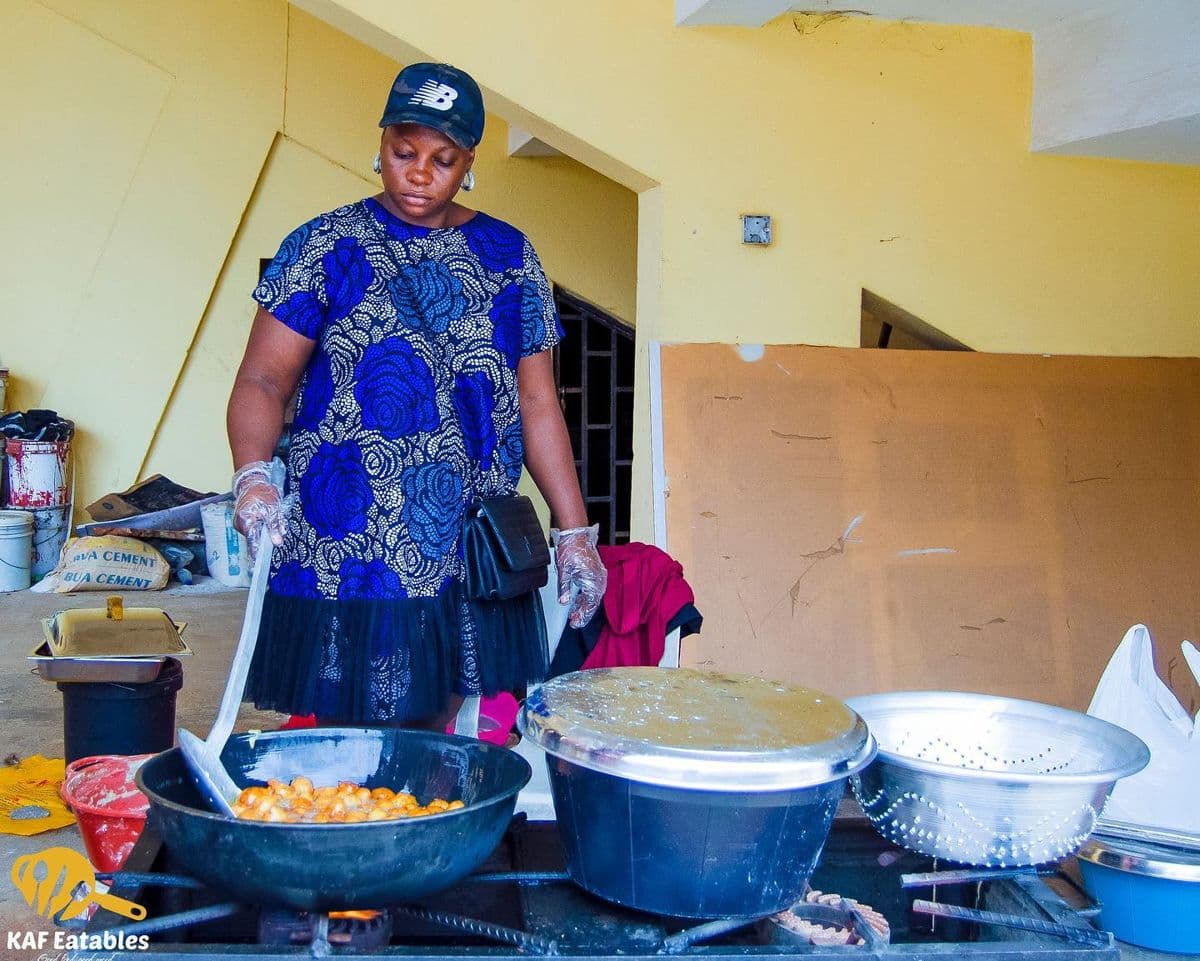 KAF Eatables outdoor kitchen setup with pots and frying pans at an event