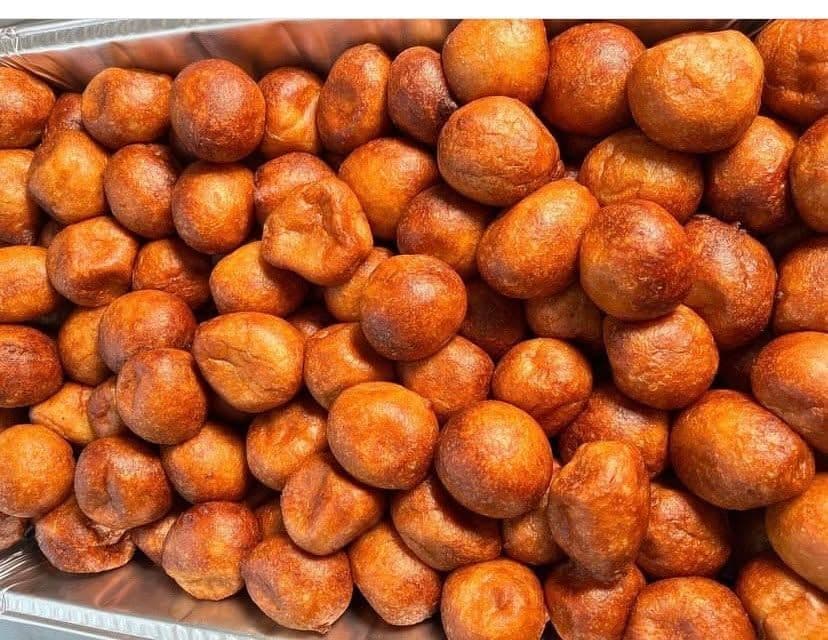 Close-up of golden KAF Eatables puff puff